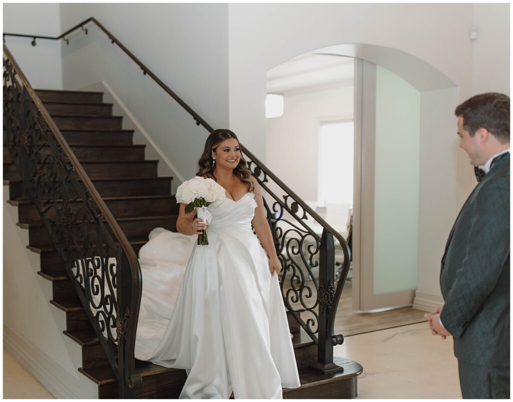 Bride and groom First Look on the staircase at Knotting Hill Place