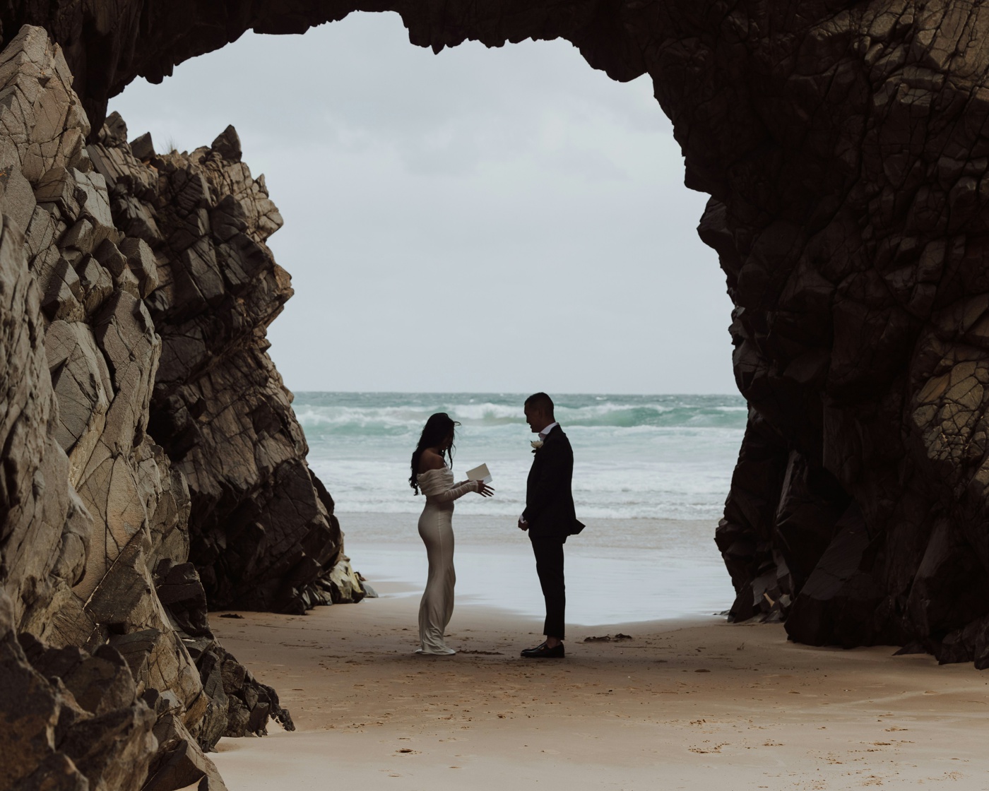 Bride and groom eloping on a beach