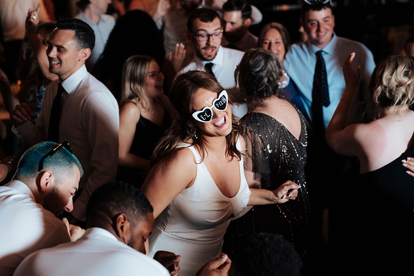bride wearing heart-shaped sunglasses